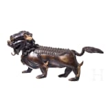 A Chinese bronze of a striding guardian lion, circa 1900