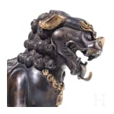 A Chinese bronze of a striding guardian lion, circa 1900