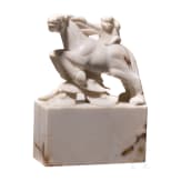 A Japanese marble Netuske carving of a monkey on a horse, probably 1900