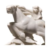 A Japanese marble Netuske carving of a monkey on a horse, probably 1900