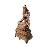 A Nepalese crystal-set bronze figurine of the Green Tara, circa 1900