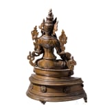 A Nepalese crystal-set bronze figurine of the Green Tara, circa 1900