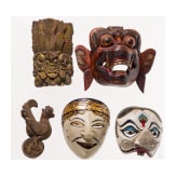 Four mainly Javanese masks and an Indonesian carved wooden chicken, 20th century