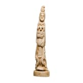 An ivory figure showing a woman with fruits, probably Indian, circa 1900
