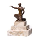 A kneeling torchbearer