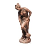 A German cast stone garden statue of a bathing nymph, 20th century