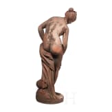 A German cast stone garden statue of a bathing nymph, 20th century