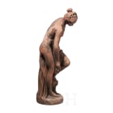 A German cast stone garden statue of a bathing nymph, 20th century