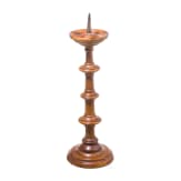 A German turned wood disc candlestick, 16th/17th century