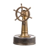 A German brass steering wheel-shaped cigar cutter, circa 1900