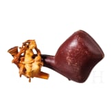 A carved meerschaum pipe with case