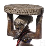 A Congolese caryatid stool and a kifwebe mask of the Songye people