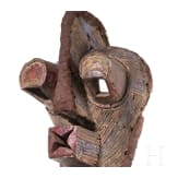 A Congolese caryatid stool and a kifwebe mask of the Songye people