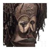 A Congolese cihongo mask of the Chokwe and a small Songye "fetish figure"