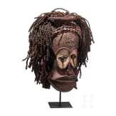 A Congolese cihongo mask of the Chokwe and a small Songye "fetish figure"