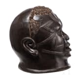 A Congolese Nkisi power figure ("nail fetish" of the Bakongo), a Mozambican mask (Makonde) and a bronze bag (Benin)