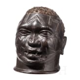 A Congolese Nkisi power figure ("nail fetish" of the Bakongo), a Mozambican mask (Makonde) and a bronze bag (Benin)
