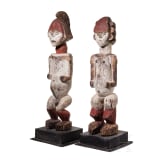 A pair of Gabonese/Congolese standing Kota (Mbete) reliquary figures