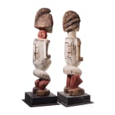 A pair of Gabonese/Congolese standing Kota (Mbete) reliquary figures