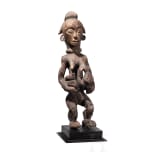 A Gabonese female figure of the Punu and a relic shrine of the Fang, 20th century