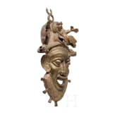 A heavy Cameroonian brass mask of the Bamum/Bamileke