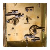 An antique French travelling clock with alarm function, late 19th century