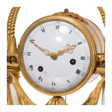 A gilt-bronze and alabaster table clock, an enamel and brass stoup and a putto, French, Paris, circa 1780 (clock)/late 19th century