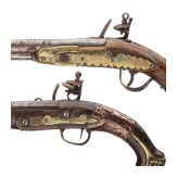 Two Moroccan flintlock pistols and a powder flask, 19th./20th century