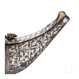 A silver decorated Indian powder flask, 19th century