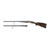 A side by side combination gun with extra side by side shotgun barrel in case