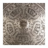 A heavy etched round shield, collector's replica in the style of the 16th century