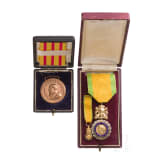 A cased French and Baden medal