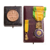 A cased French and Baden medal