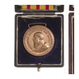 A cased French and Baden medal