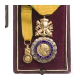 A cased French and Baden medal