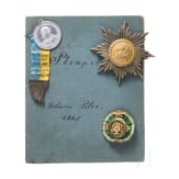 Three badges and a small collection of seals, 19th century