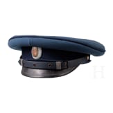 A peaked cap for officers (probably a military doctor) and an epaulette for a first lieutenant, World War I