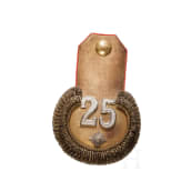 A peaked cap for officers (probably a military doctor) and an epaulette for a first lieutenant, World War I