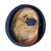 A peaked cap for officers (probably a military doctor) and an epaulette for a first lieutenant, World War I