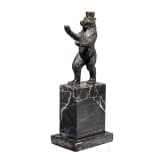 A sculpture of the Berlin bear on a marble pedestal, circa 1935/40