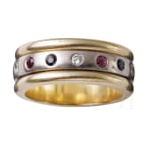 A 14ct white gold band ring set with diamonds, rubies and sapphires