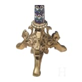 A set of four French gilt and enamelled pricket candlesticks in romanesque style, late 19th century