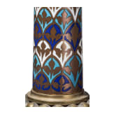 A set of four French gilt and enamelled pricket candlesticks in romanesque style, late 19th century