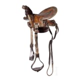 An Indopersian saddle with silver damascened stirrups, 19th century