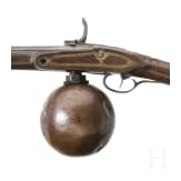 A German air rifle with ball reservoir and pump, circa 1780