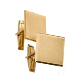 Ein Paar goldene Manschettenkn&ouml;pfe