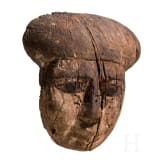 A wooden mummy mask with traces of paint, Late Period, mid-3rd of the 1st millennium B.C.