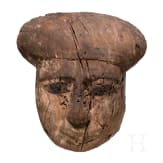 A wooden mummy mask with traces of paint, Late Period, mid-3rd of the 1st millennium B.C.