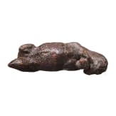 An amber figure of a lying bull, Greek, 4th century B.C.