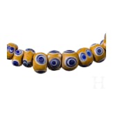 61 yellow-based eye beads, Celtic, 5th&ndash;4th century B.C.